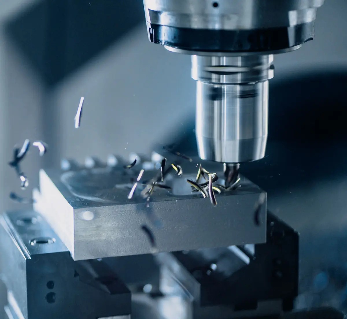 CNC milling cutter machining a steel component
